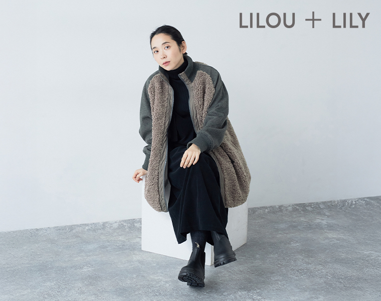 Lilou＆Lilyのボアナイロンハーフコートを着た女性（正面・着座）