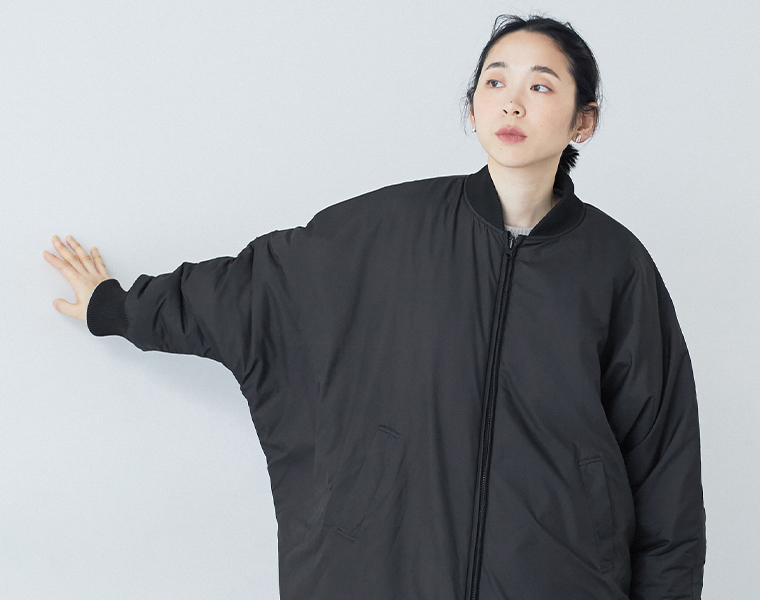 キルティングリバーシブルドルマンコートの袖ライン見せ